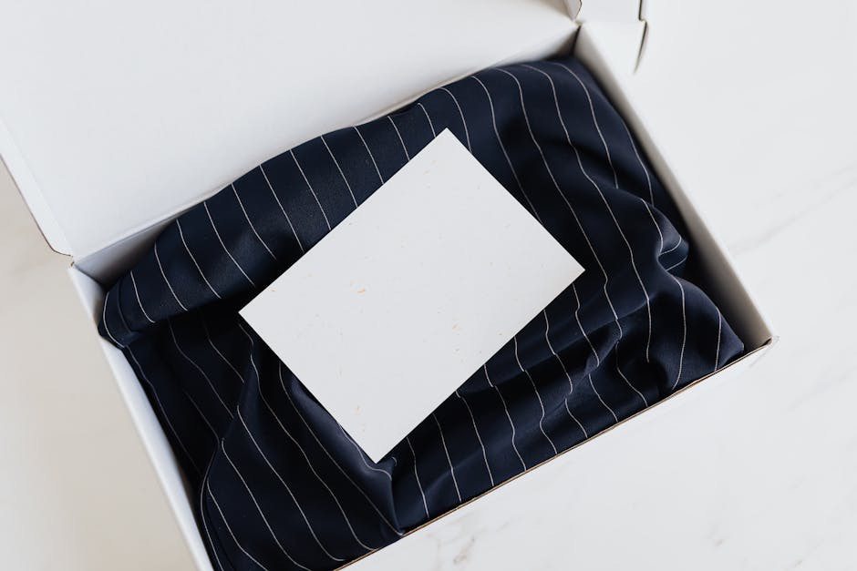 A navy blue fabric gift box with a blank card on top, perfect for special occasions.