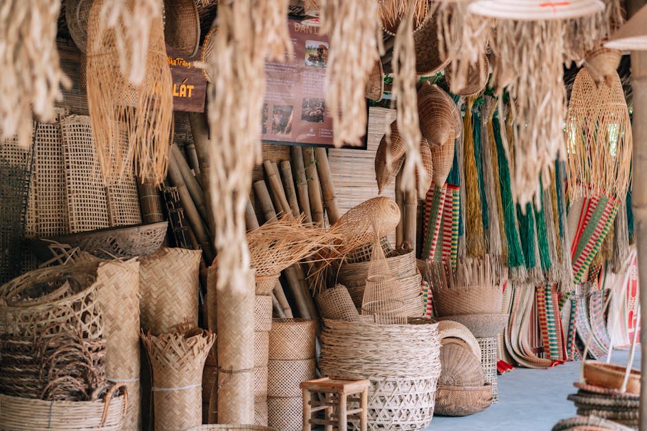 Collection of traditional handmade wicker baskets on display at a rural market.