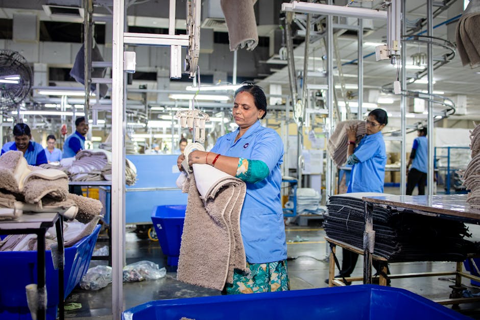 Workers in a textile factory sorting materials efficiently and methodically.
